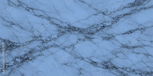 A closeup of white frozen frost patterns on a blue winter window creates an abstract icy texture against a cold snowy landscape