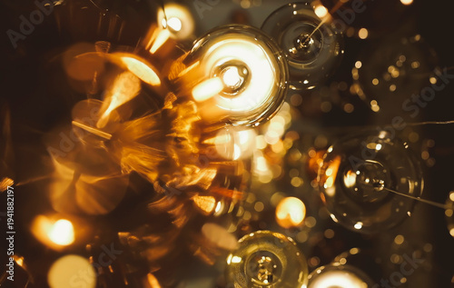 Luxury beautiful retro edison light lamp decor. A bunch of light bulbs hanging from the ceiling. The bulbs are all different sizes and colours. Scene is warm and inviting