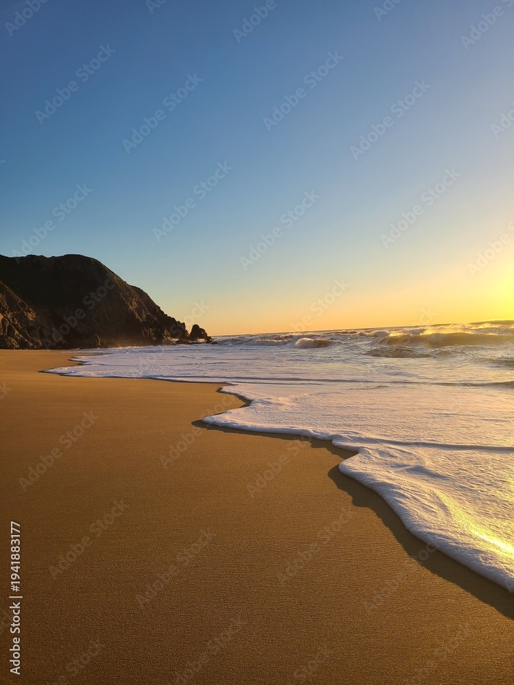 Fototapeta premium Sea foam at sunset