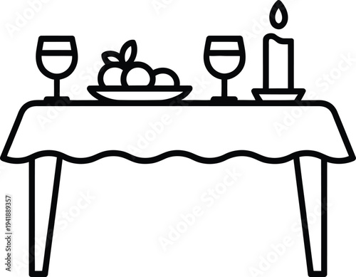 A simple table setting with wine glasses and a candle