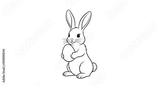 Cute bunny holding Easter egg in playful pose