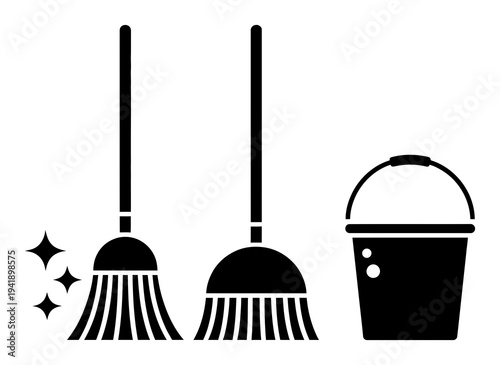 Black and white of two brooms and a bucket with sparkles