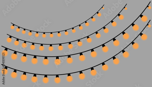 Warm orange string lights on black cords
