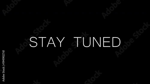 Text animation stay tuned with blurring text on a black isolated background. 4K