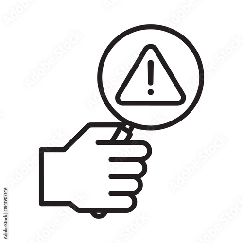 A hand holding up a warning sign with an exclamation point