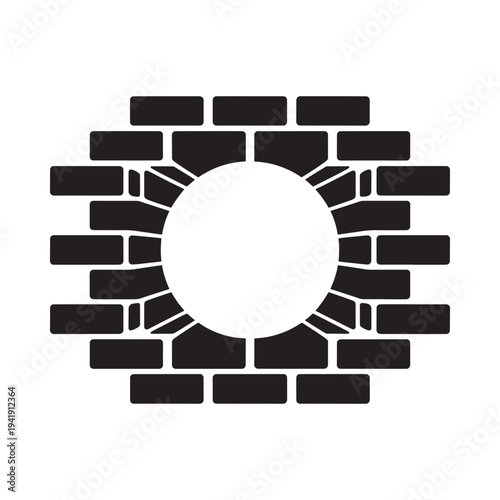A circular opening surrounded by a brick wall in black and white