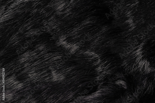 Foto Close up of elegant deep black natural animal fur texture background with soft l