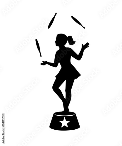 Girl juggling pins performing on circus pedestal