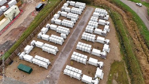 Fotografie Aerial drone view of a large-scale battery energy storage system (BESS) in Burwell, UK, supporting grid resilience and renewable power supply