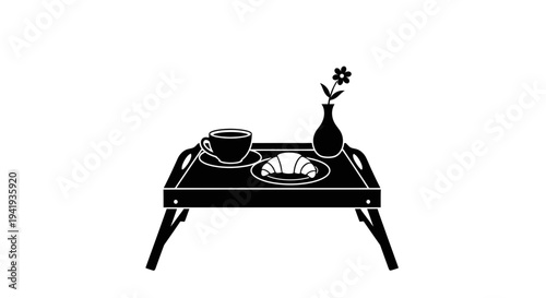 Simple black and white illustration of a table setting with a vase and dishes.
