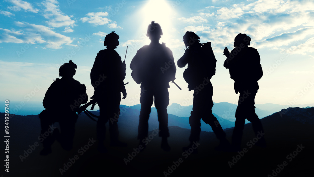Obraz premium Military soldiers stand in silhouette during the Iran USA conflict at dusk in a mountainous area