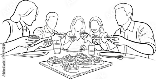 A diverse group of people enjoys a communal meal of small appetizers