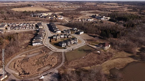 Aerial Drone View of Spring Waterfall and Rapid River Flow During Snowmelt in Paris Ontario Canada