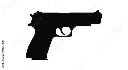 A stark black silhouette of a handgun resting on a white surface conveying potential danger silhouette