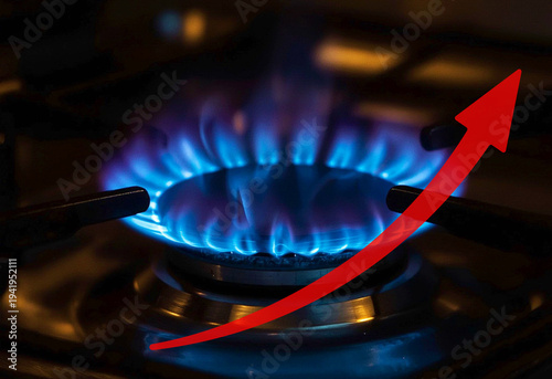 Natural Gas Price Hike and Energy Crisis Concept: Blue Gas Stove Burner with Red Curved Upward Rising Arrow representing Inflation, High Heating Bills and Growing Utility Costs in Global Economy.