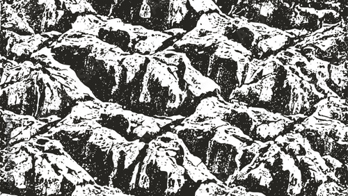 Mountains landscape with rugged rocky peaks under dramatic cloudy sky in monochrome