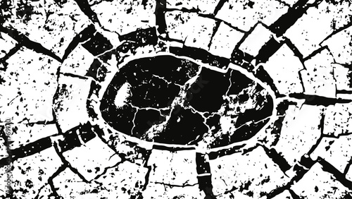 Cracked dry soil surrounding a large oval drought affected patch in arid land