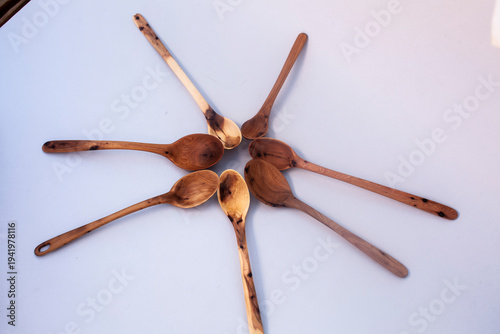 Wooden kitchen utensils stacked view closeup