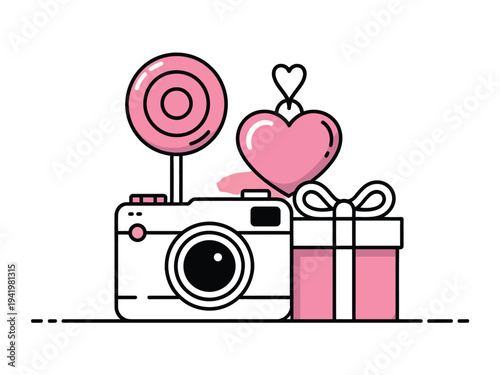 A white digital camera sits beside a pink lollipop and a hanging heart charm next to a gift.