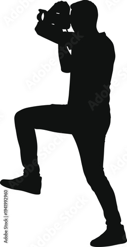 Professional photographer taking a photo with a camera silhouette.