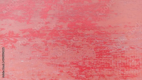 Faded Red Wooden Surface Texture Background. Worn red wooden surface with subtle grain and distressed texture detail