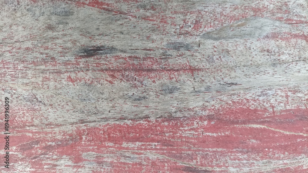 Obraz premium Distressed Red Painted Wood Background. Close up of worn red paint over natural wood grain, textured rustic surface