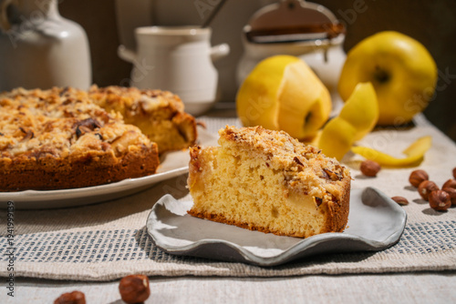 Apple crumble cake topped with hazelnuts