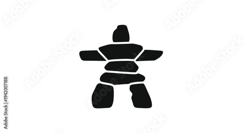 Stacked stones forming a human like figure a dark silhouette