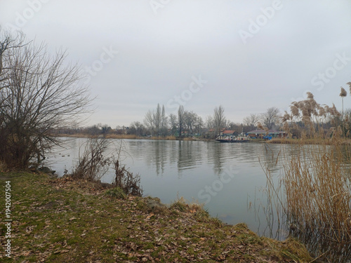 winter riverbank with car ferry