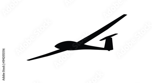 A sleek glider aircraft in flight presented as a dark silhouette