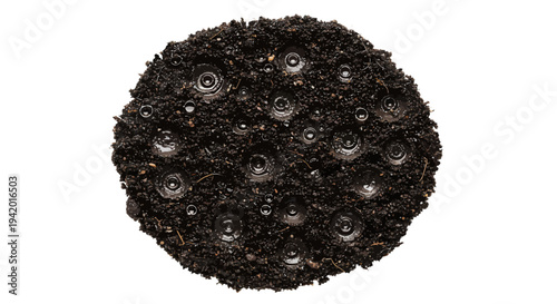 Dark soil with water droplets on surface for gardening or agriculture