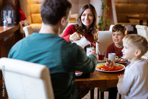 Family enjoys breakfast tog...