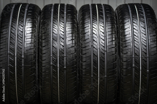 A stack of new rubber car tires