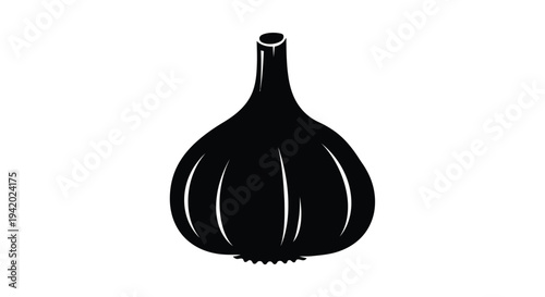 A striking black silhouette of a whole garlic bulb