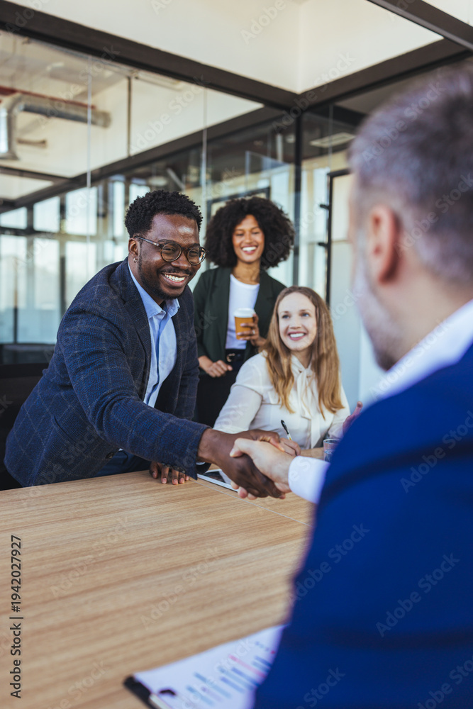 Fototapeta premium Business Team Handshake During Successful Office Meeting Showing Partnership, Collaboration and Professional Confidence