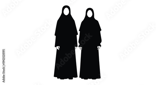 Two women in traditional niqabs standing together a striking silhouette