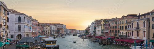 Venice Grand Canal with gondola and water taxi in sunset