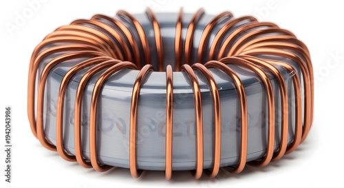 Closeup of toroid inductor coil with copper wire wound around grey core on white background