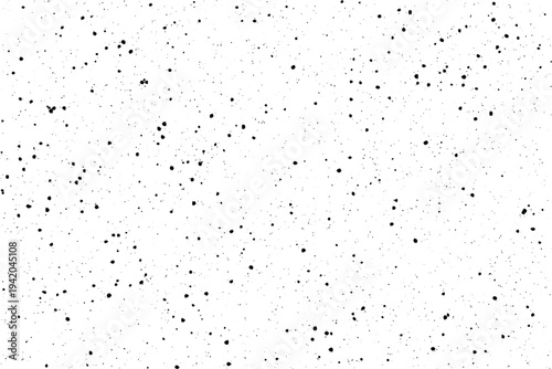 A collection of tiny black irregular marks creates a distinctive visual noise across a pure white area