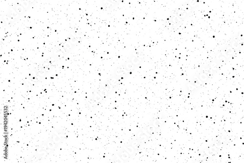 A dense scattering of tiny irregular black speckles creates a subtle grunge effect on a bright white surface