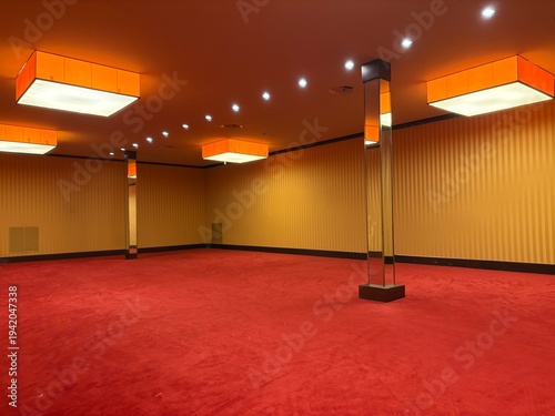 Konstfotografi Large empty conference or event hall with red carpet floor, modern ceiling lights and elegant interior design