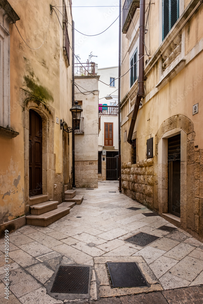 Fototapeta premium Altamura, houses streets and alleys of a small town in the south, southern Italy. Typical town in the Mediterranean. Narrow streets of old town of Altamura, Puglia, Italy