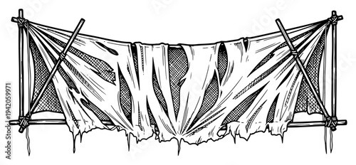 Old torn banner made of tattered cloth tied to wooden poles