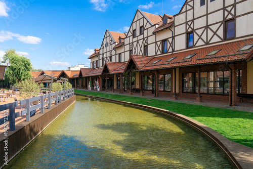 Photography Architectural landscape with modern half timbered buildings, tiled roofs, and a