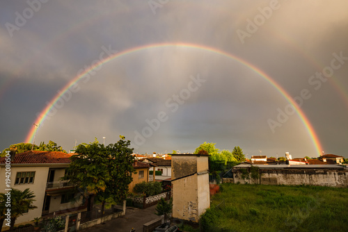 Wallpaper Mural Vibrant Vertical Rainbow Over European Rooftops at Golden Hour Torontodigital.ca