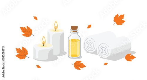 A cozy autumn-themed spa arrangement features two lit white pillar candles, a glass bottle of yellow essential oil, two rolled white towels, and scattered orange maple leaves.