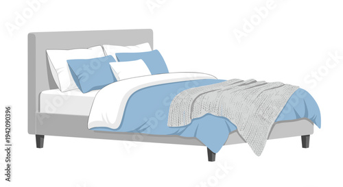 A neatly made bed with a grey upholstered headboard, white and blue bedding, and a textured grey knitted blanket is displayed.