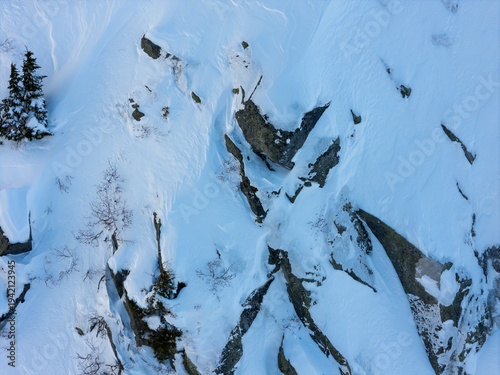 Aerial View of Snow-Covered Rocky Mountain Slope in Winter, BC, Canada