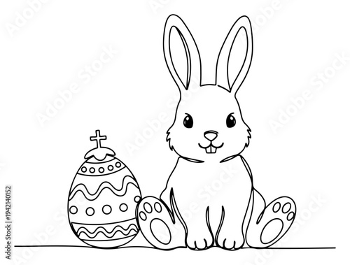Photography Cute bunny sitting next to decorated easter egg with cross