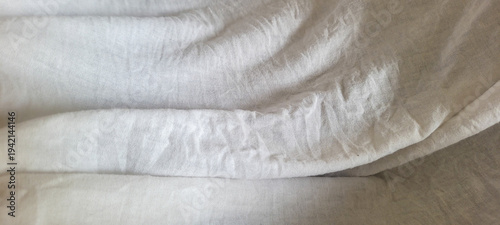 folded white fabric with thin fabric